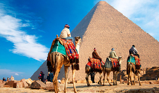 Bedouins on camels near the great pyramid.