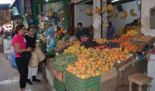 Kathy shopping with the chef for their cooking lesson in Morocco.