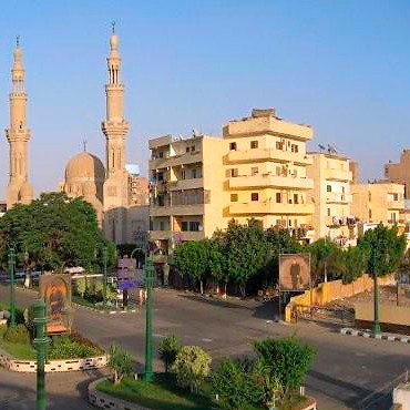 Mosque and street landscape in Minya, Egypt.
